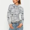 SOLADO Mock Neck Newspaper Print Long Sleeve Top 2 SOLADO Mock Neck Newspaper Print Long Sleeve Top -SOLADO Shop jpeg 89c53b0a b17a 40c4 a647 5b8b71f1acb7 1800x1800